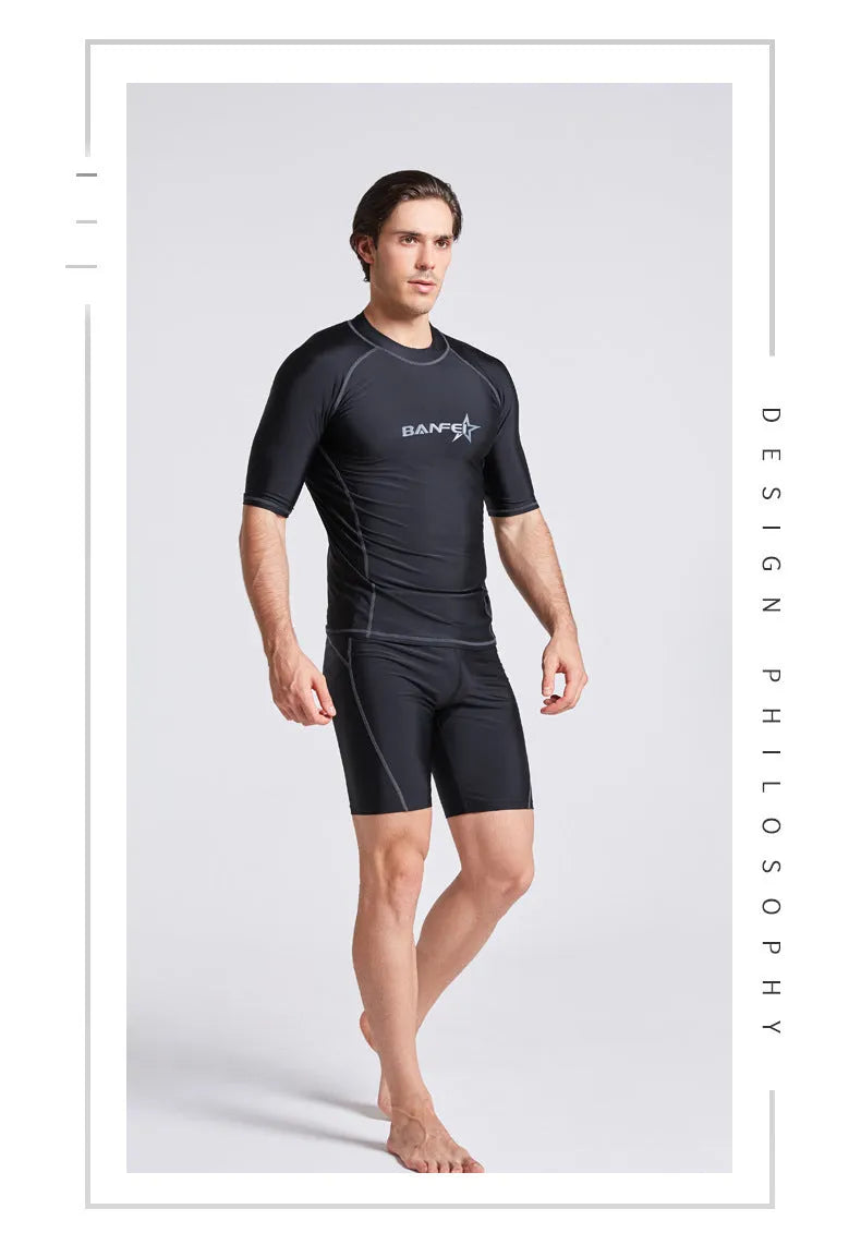 Men's navy blue quick-drying nylon swimsuit set with half-sleeve top and pants for swimming and surfing.
