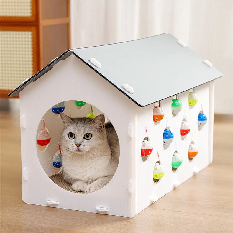 Plastic cat scratch board toy with integrated raised cat nest, tunnel, and bell ball.