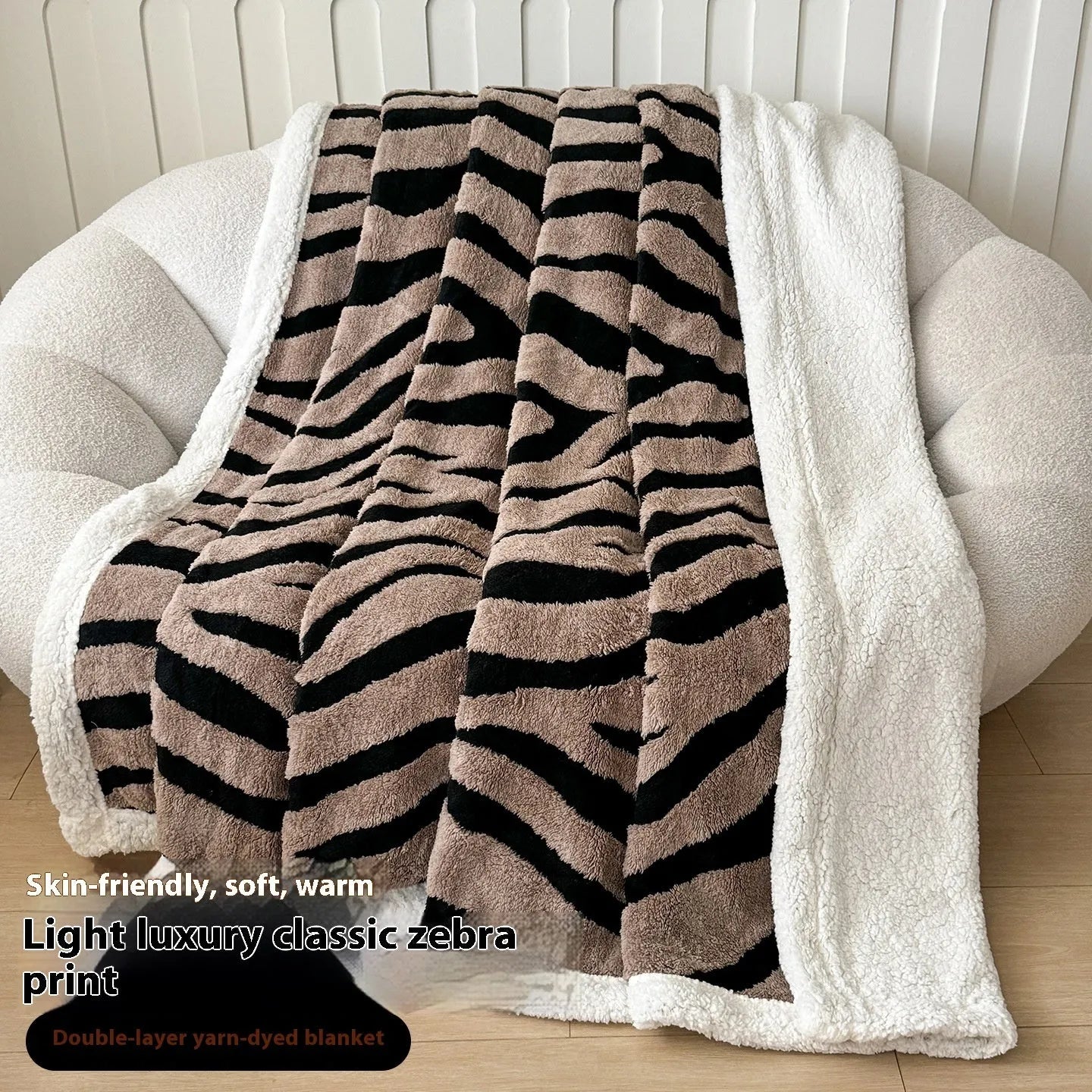 Double-layer leopard jacquard taffeta blanket in camel zebra pattern on a single bed.