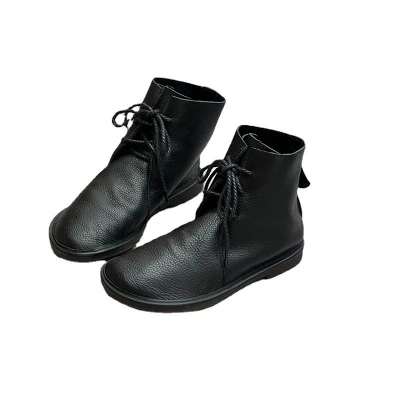 Retro genuine leather Martin boots for women in black, flat heel, round toe, front tie strap.