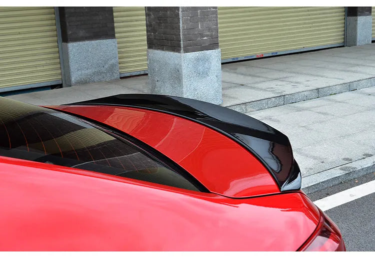 Bright black Mazda 3 Axela Exela tail trim for 2014-2021 models with large fixed wind surround design