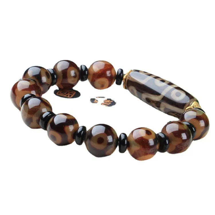 Agate Tibetan dzi bead bracelet with three-eye design and polished finish