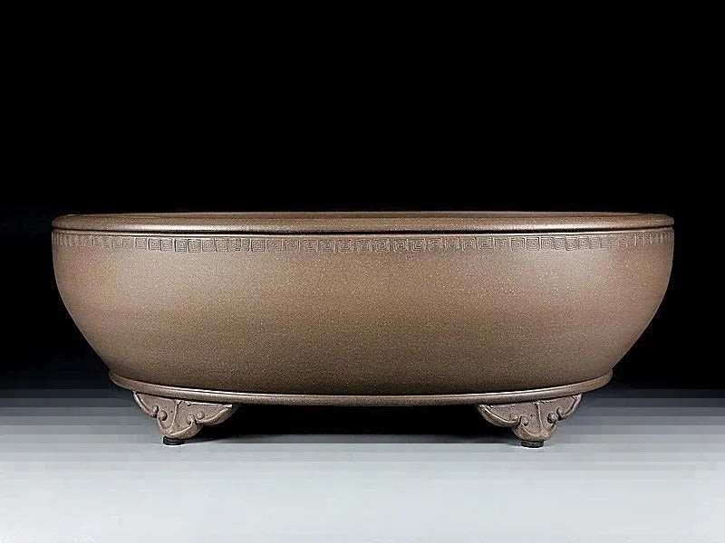 Handmade oval purple sand flowerpot in black mud green colour measuring 50x39.5x16cm