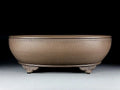 Handmade oval purple sand flowerpot in black mud green colour measuring 50x39.5x16cm