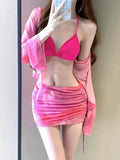Women's blue high waist swimsuit four-piece set with shirt, bra, underwear, and skirt on beach