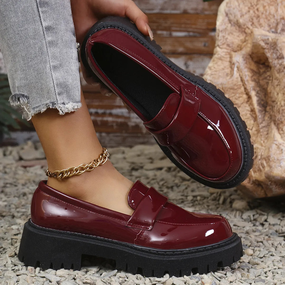 Women's black slip-on loafers with chunky platform heel and solid colour design