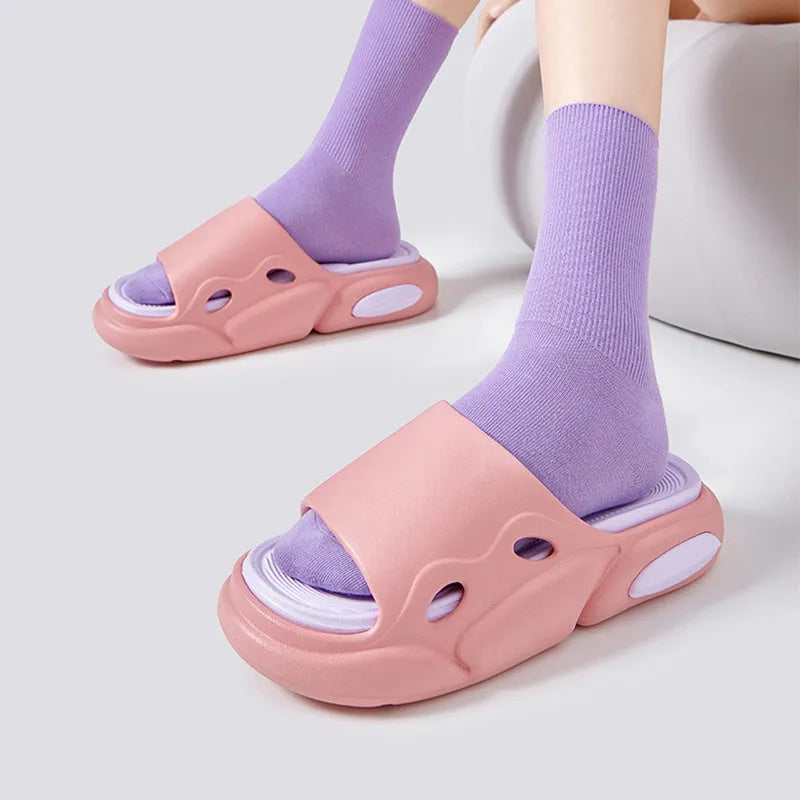 Two-colour EVA slippers for men and women with thick sole, shown in pink and purple colour option.