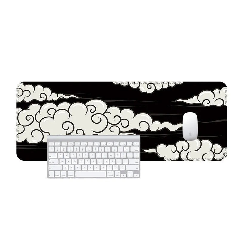 Large rectangular cloud pattern desk mat made of natural rubber on a wooden desk.