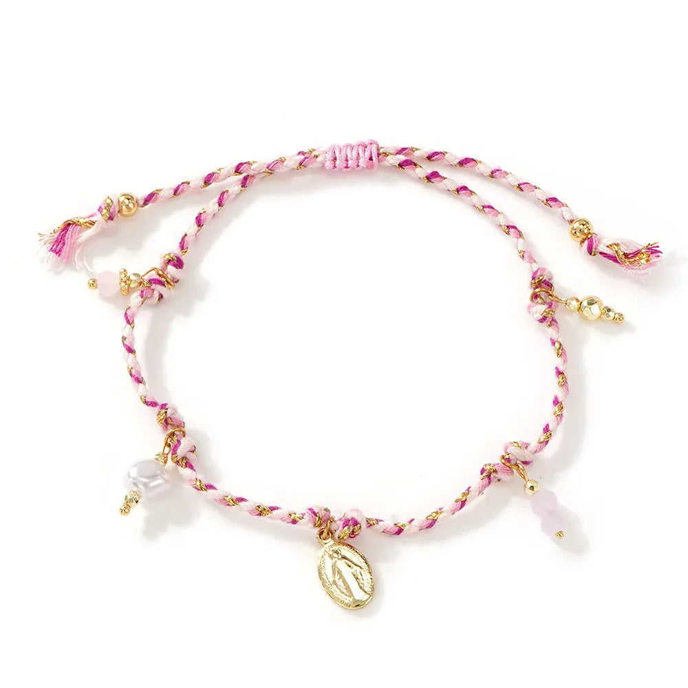 Close-up of a hand-woven colourful braided rope bracelet for women with a carrying strap tag.