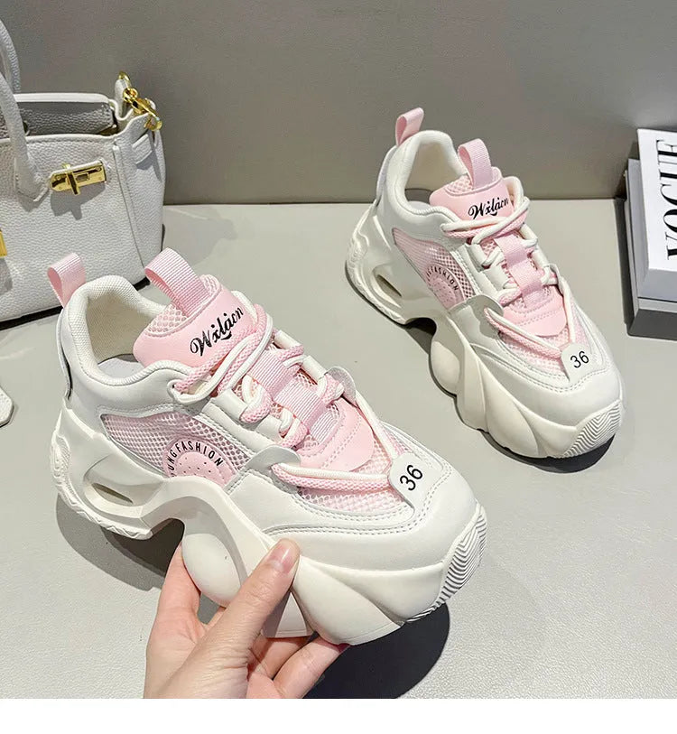 Women's beige sneakers with cross shoulder straps and a thick mid-heel sole