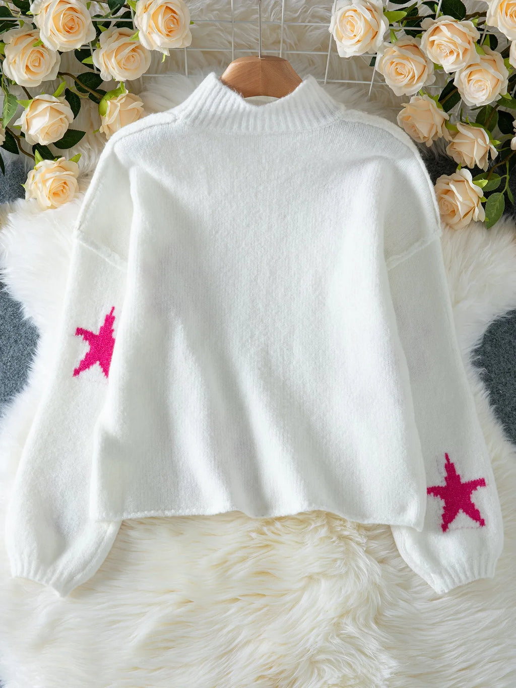 White women's loose fit turtleneck pullover with five-pointed star pattern detail