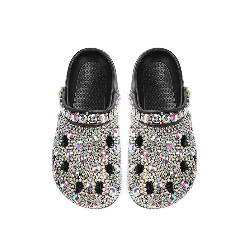 Black women's platform sandals with rhinestones around holes and a textured EVA sole.