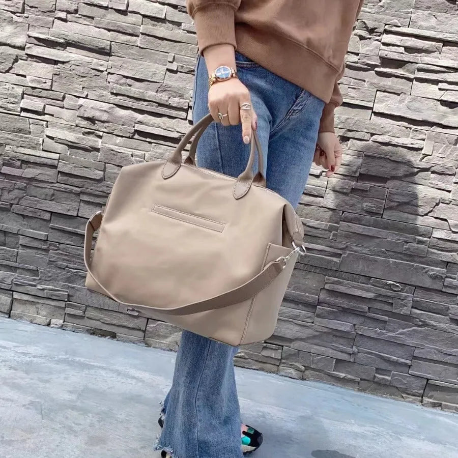 Nylon waterproof cloth shoulder bag with leather accents in black or light khaki colour