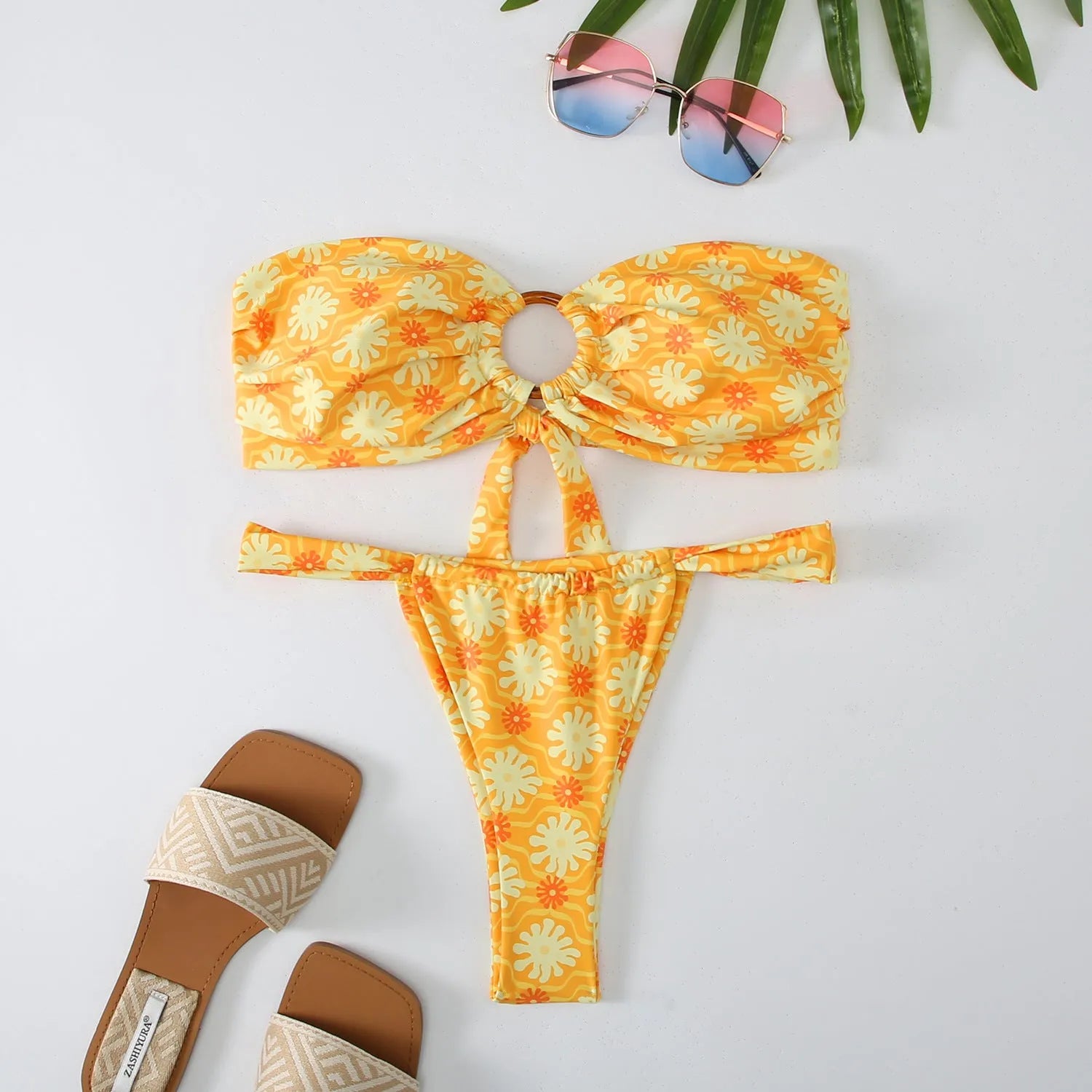 Women's floral printed tube top ring bikini set with backless design on mannequin