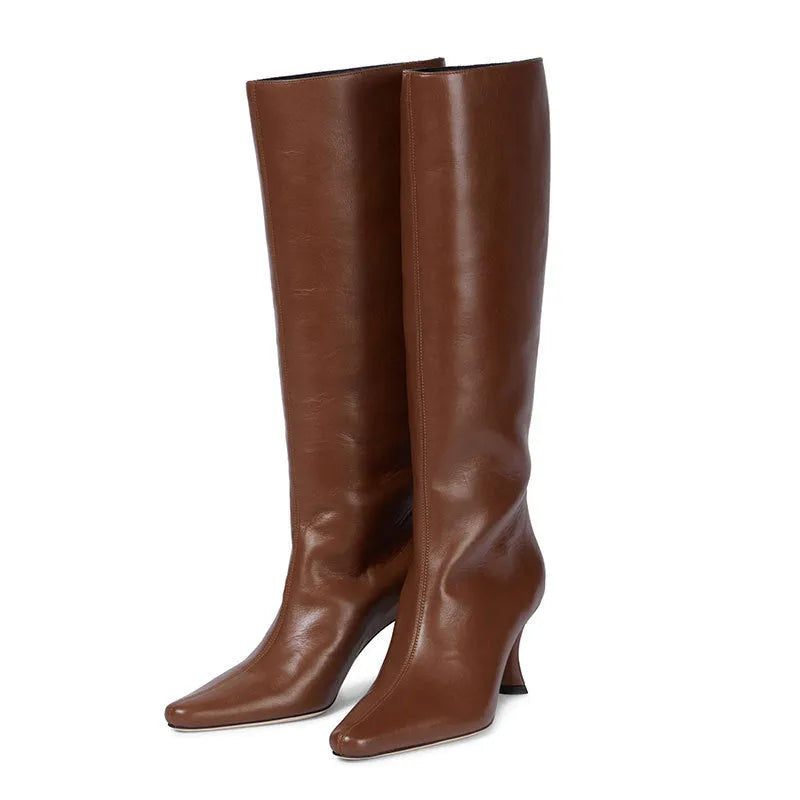 Women's square toe cowboy boot in a selection of colours including black, snake pattern, and brown stone.
