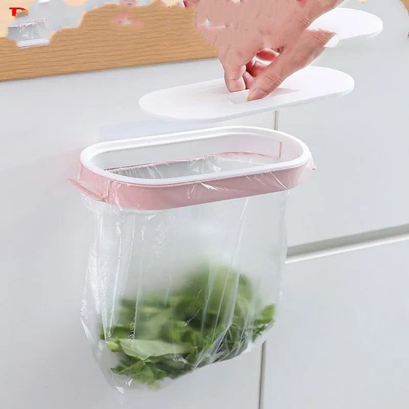 Blue foldable plastic kitchen garbage bag storage rack mounted on a cabinet door.
