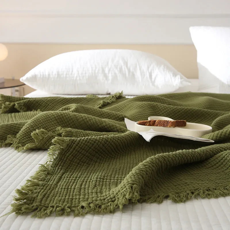 Four-layer gauze cotton blanket with tassel detailing in navy blue colour option