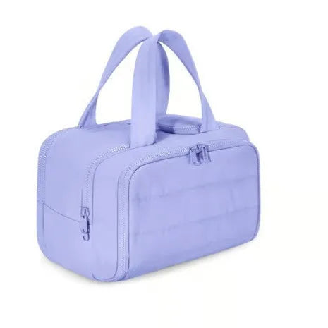 Large fluffy travel toiletry bag in beige colour with wide open design showing interior