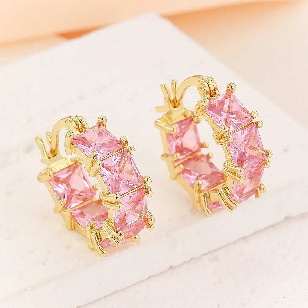Geometric U-shaped gold electroplated copper ear rings with round black zircon settings