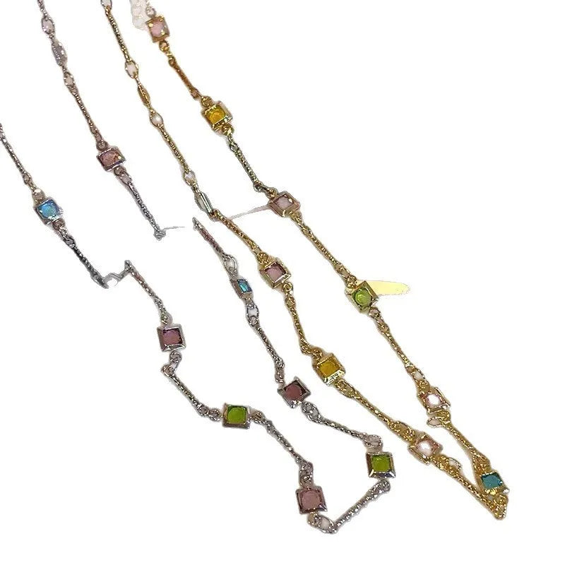 Square colour clavicle chain necklace with geometric quadrilateral crystal elements in gold and white K finishes