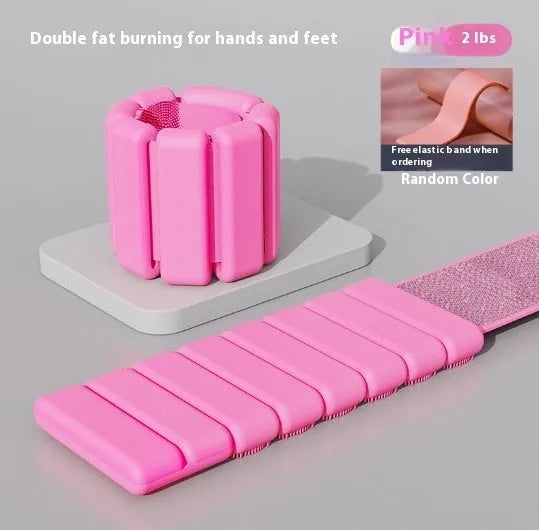 Adjustable silicone fitness bracelet with detachable 1lb or 2lb weight options in pink, black, grey and blue.