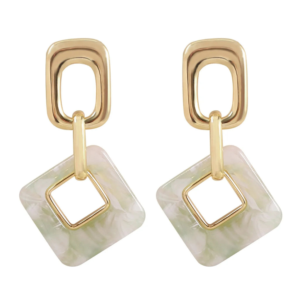 Hollow geometric square earrings with chamfered corners in metallic finish