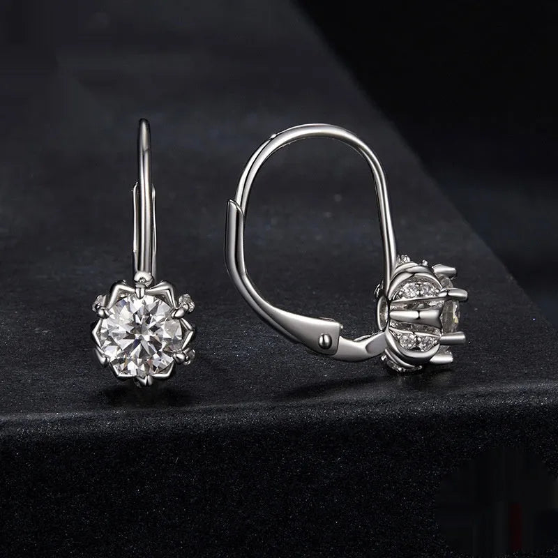 Sterling silver flower bud ear clip with white gold plating and 0.5 carat moissanite stone