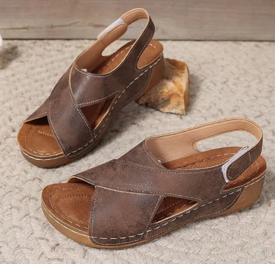 Roman platform sandals with skirt detail and adjustable Velcro strap in earthy colour options