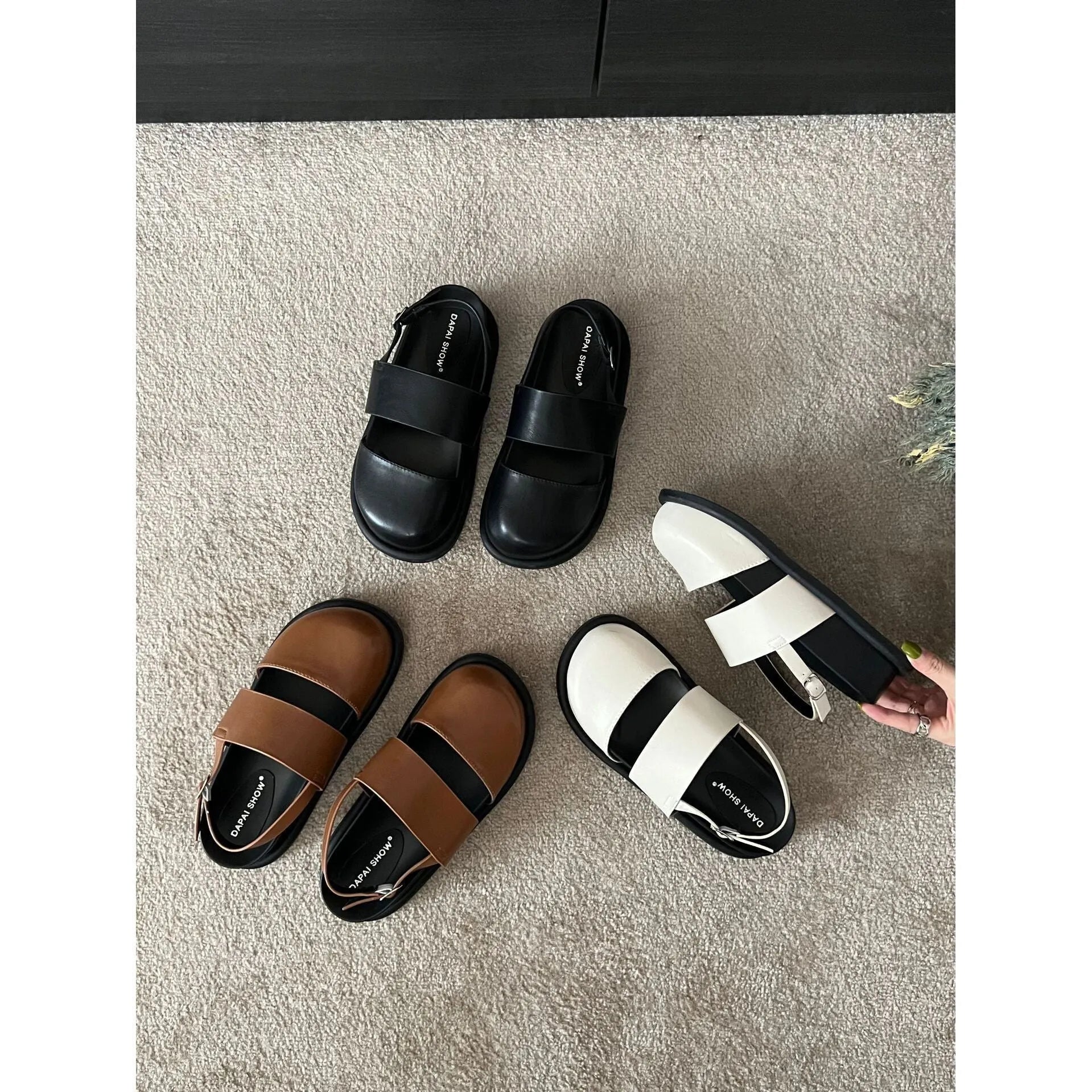 Retro closed toe sandals with raised bottom, ankle strap buckle, and round toe in apricot colour