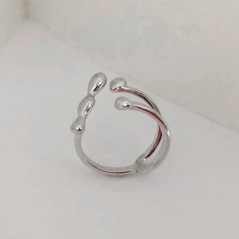 Adjustable brass opening ring with sphere design in gold colour for women