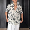 Men's loose black floral printed casual shirt with short sleeves and cardigan style