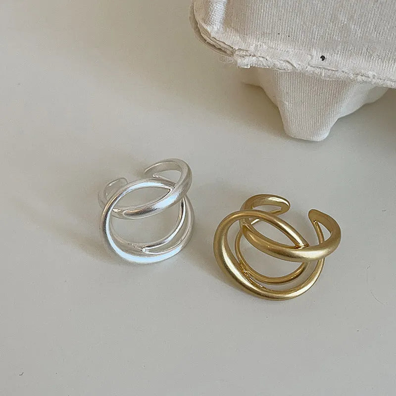 Geometric open ring for women with interlaced matte metal design and real gold plating