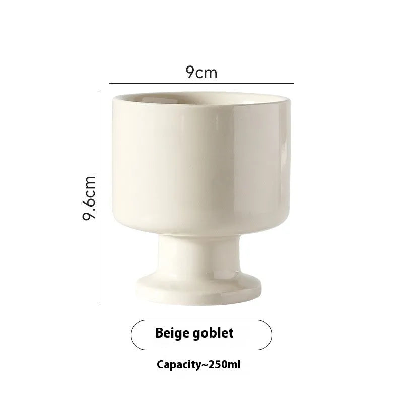 Hand-pinched irregular ceramic mug with solid colour design, approximately 14.5cm tall