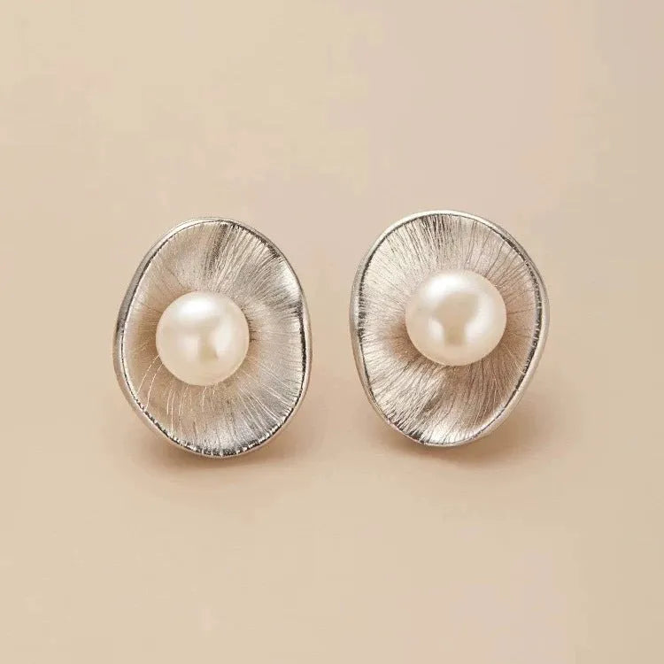 Gold tone geometric pearl stud earrings with sterling silver posts