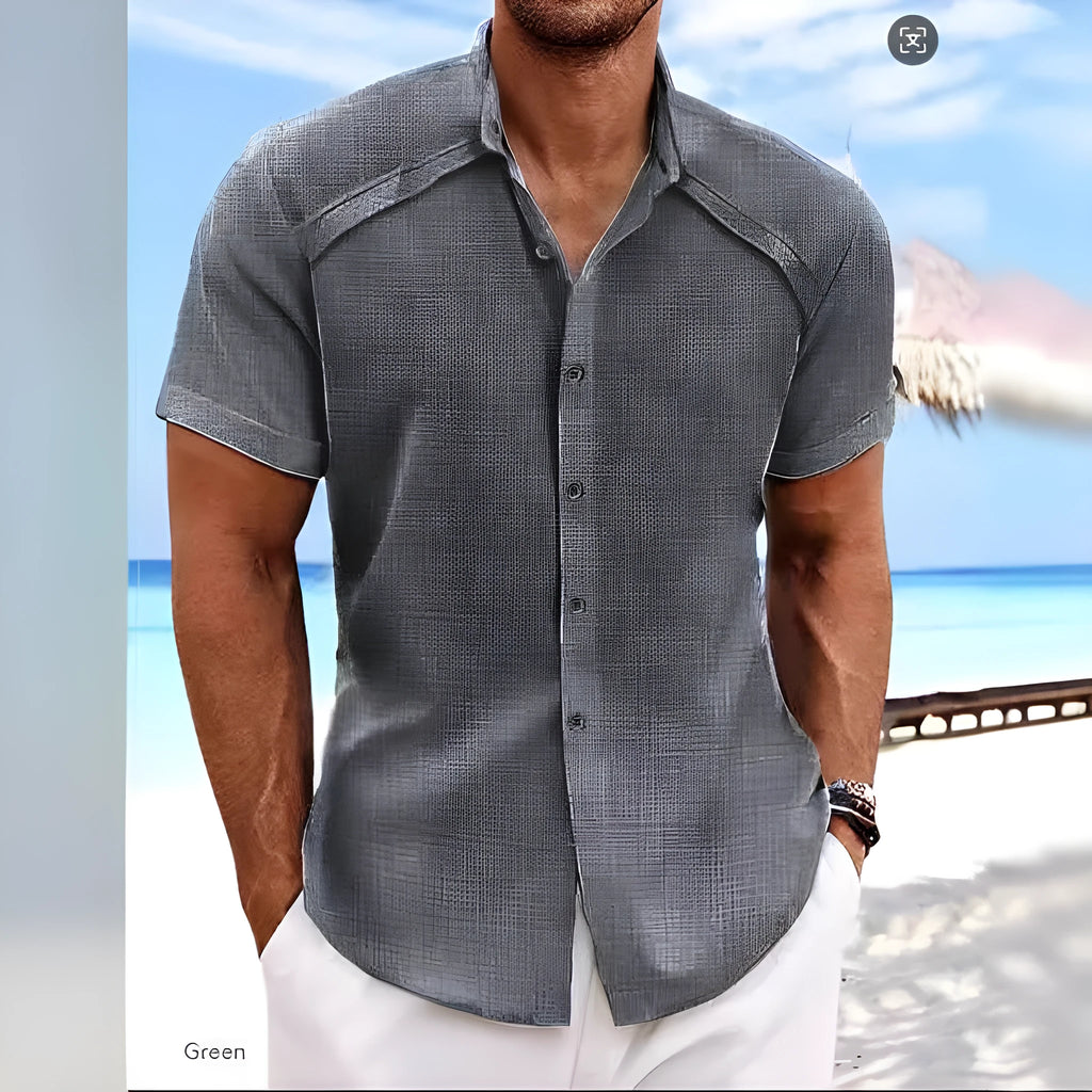 Hawaiian casual short sleeve solid colour shirt in a cotton blend fabric on a hanger.