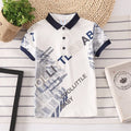 Boys short sleeve cotton T-shirt in navy blue with a lapel collar, laid flat.