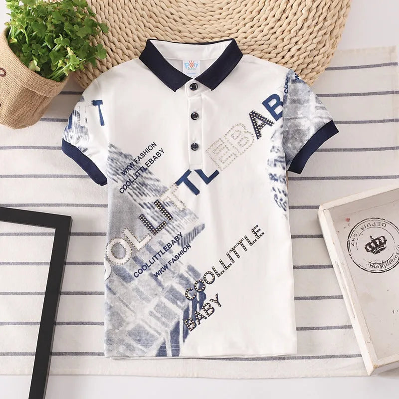 Boys short sleeve cotton T-shirt in navy blue with a lapel collar, laid flat.