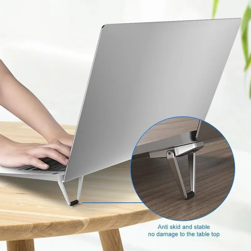 Compact foldable aluminum alloy laptop stand bracket shown in silver and white colour options.