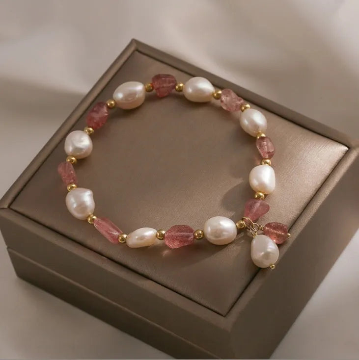 Handcrafted strawberry quartz crystal bracelet with green moon beads and peach blossom Hetian jade charm on adjustable string