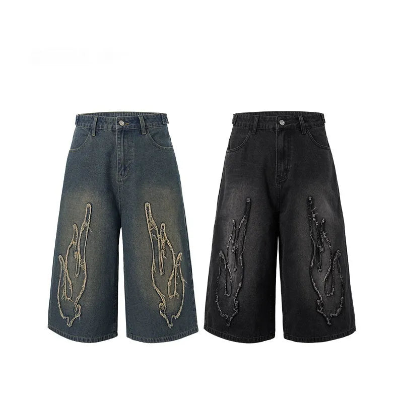 Men's black denim shorts with flame embroidery and patchwork design, straight leg cut