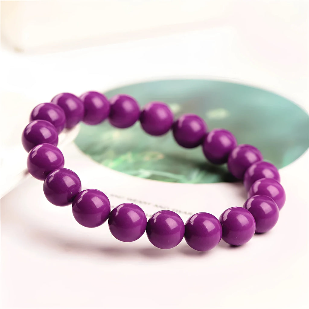 Jiuya polished crystal bracelet in 5A purple mica colour, showing single circle beads in one of three available sizes.