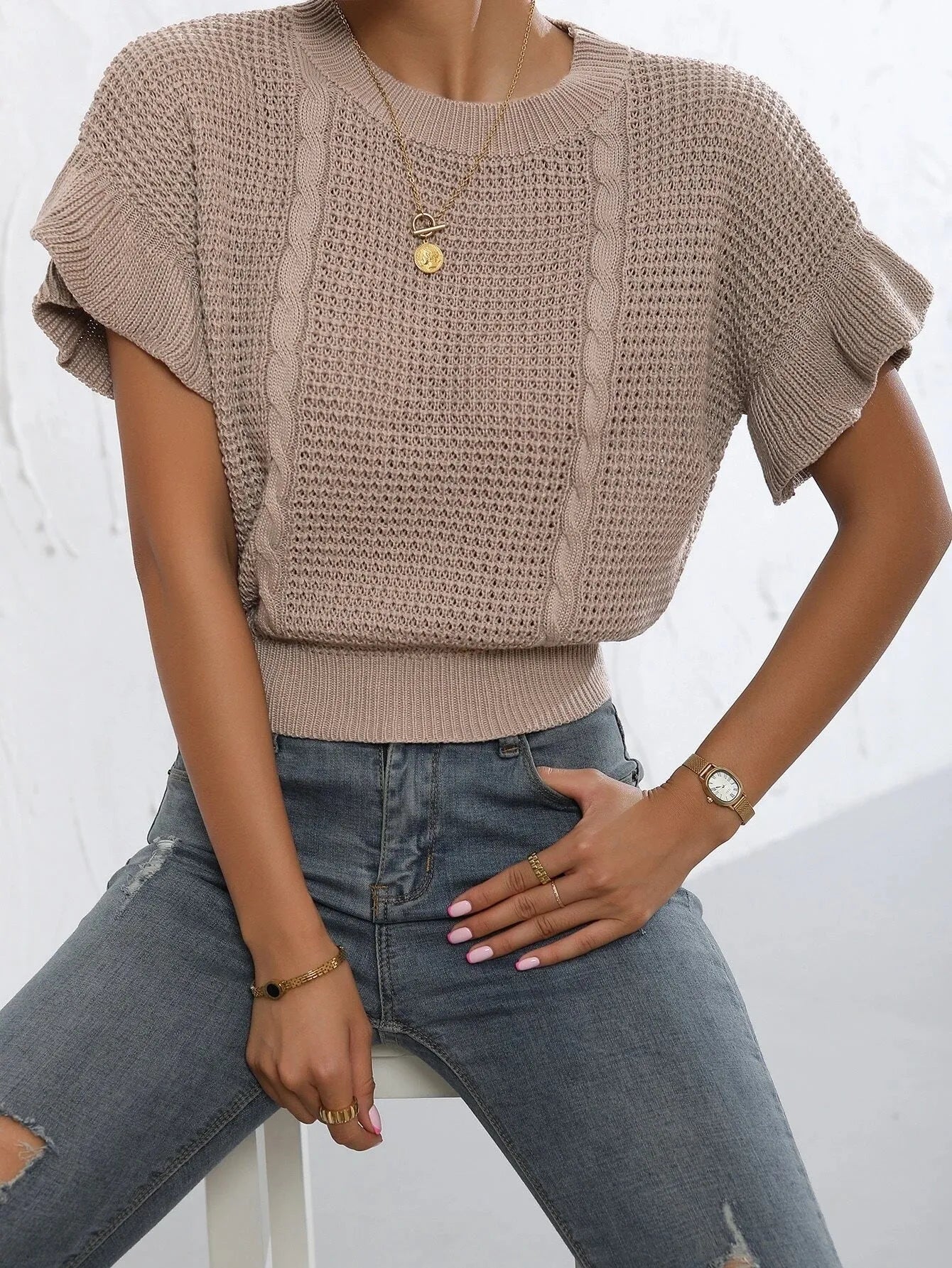 Women's loose fit knitted pullover with ruffled short sleeves and twisted string texture