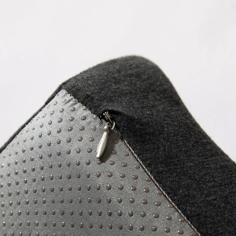 Dark grey memory foam office chair cushion for waist support, shown on a desk chair.