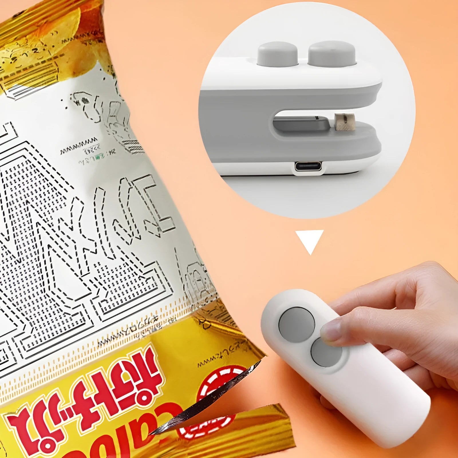 White handheld vacuum sealing machine with USB port and cutter blade on a kitchen counter.