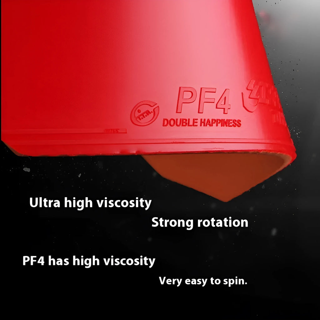 Fast Attack Sticky Classic-50 table tennis racket with red PF4-50 anti-rubber on a wooden table.