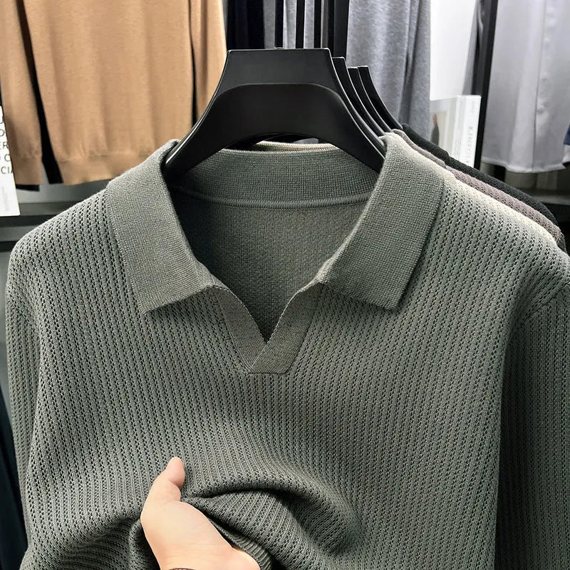 Men's loose fit plain pullover sweater in green, shown on a model for scale.