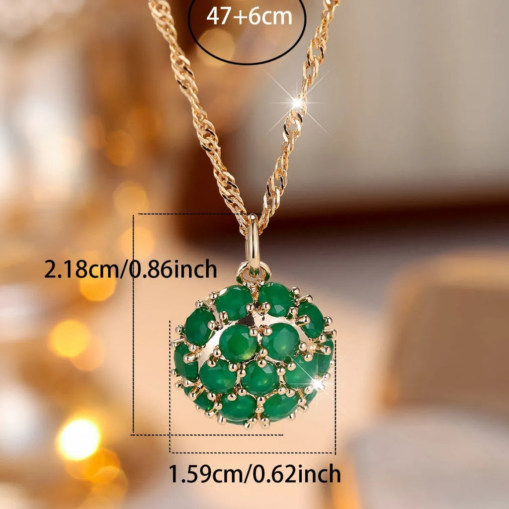 Round emerald pendant with full diamond setting on champagne gold chain necklace