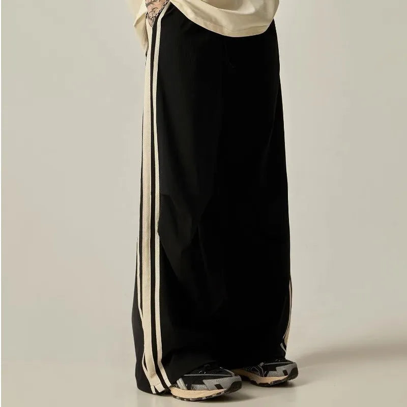 Black wide-leg climbing trousers with high waist design shown flat