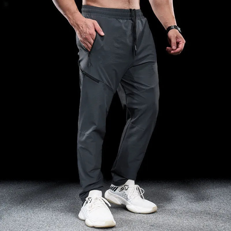 Men's waterproof quick-dry nylon exercise trousers in Army Green colour with mid waist design