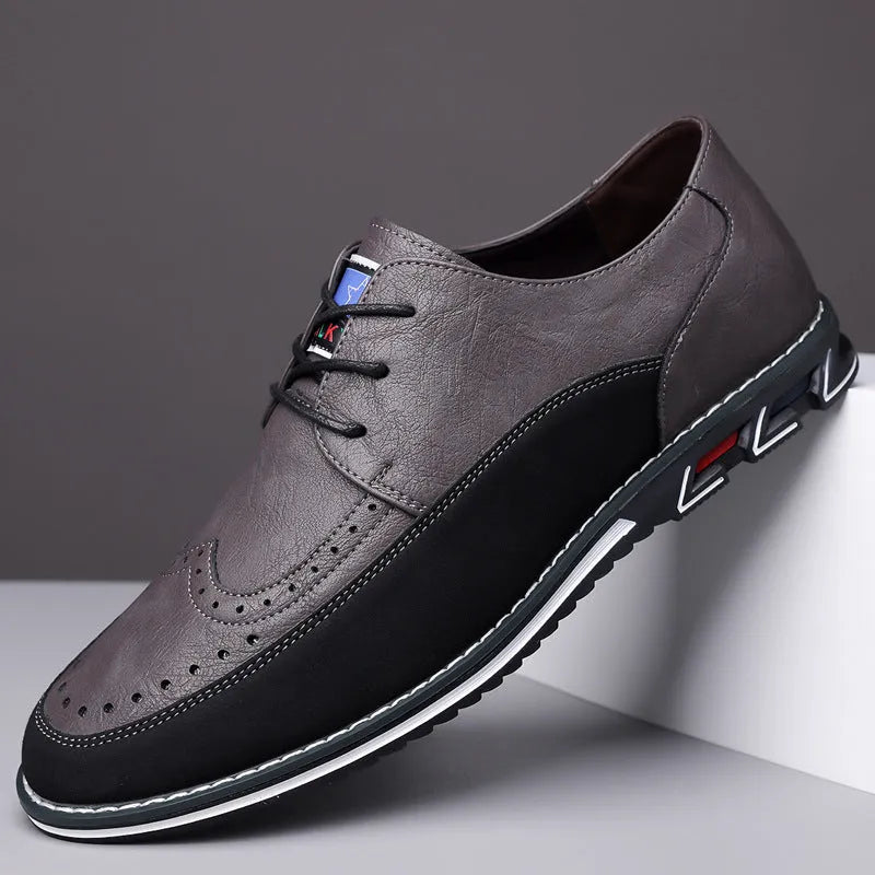 Men's black casual leather slip-on shoes with a rubber sole and visible sewing line details on a leather toe cap.